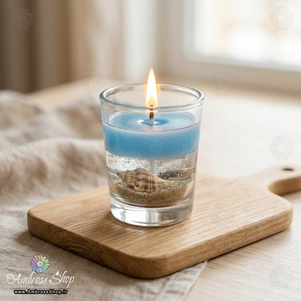 شمع ظرف شیشه ای طرح دریا ژله ای آبی با صدف طبیعی فانتزی دکوری امبرز شاپ